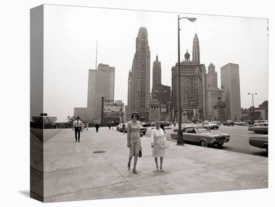 Two Ladies Walking the Sidewalk Skyscrapers in Chicago America's Windy City, in the 1960s-null-Premier Image Canvas