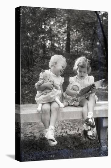 Two Little Girls Sitting on a Bench-Philip Gendreau-Premier Image Canvas