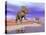 Two Nedoceratops Next to Water in a Colorful Rocky Landscape-null-Stretched Canvas