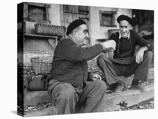 Two Older Basque Men Sitting on a Porch Toasting, as They Prepare to Drink Together-Dmitri Kessel-Premier Image Canvas