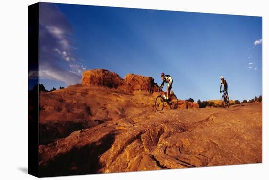 Two people mountain biking, Moab, Utah, USA-Richard Sisk-Premier Image Canvas