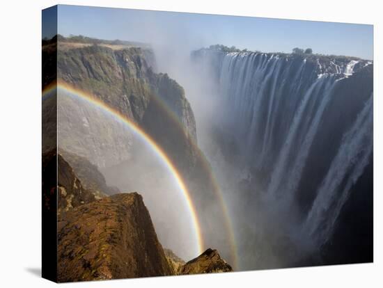 Two Rainbows Rest in Between Zimbabwe and Zambia Seen from the Zambian Side of Victoria Falls.-Karine Aigner-Premier Image Canvas