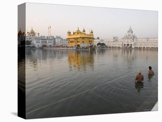 Two Sikh Pilgrims Bathing and Praying in the Early Morning in Holy Pool, Amritsar, India-Eitan Simanor-Premier Image Canvas