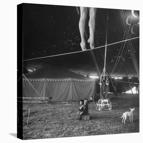 Two Small Children Watching Circus Performer Practicing on Tightrope, Her Legs Only Visible-Nina Leen-Premier Image Canvas