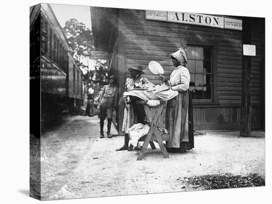 Two Young Black Women Selling Cakes at Alston Railroad Station, Next to a Train That Has Stopped-Wallace G^ Levison-Premier Image Canvas