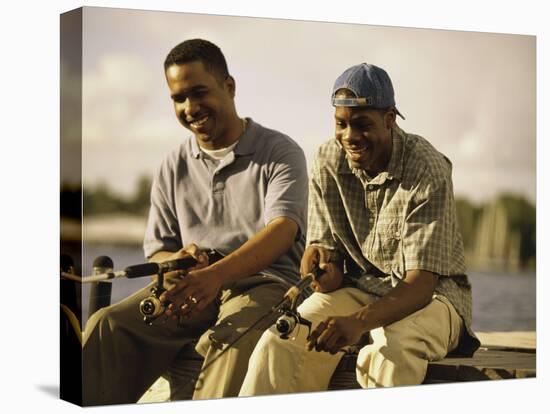 Two Young Men Sitting on The Pier Fishing-null-Premier Image Canvas
