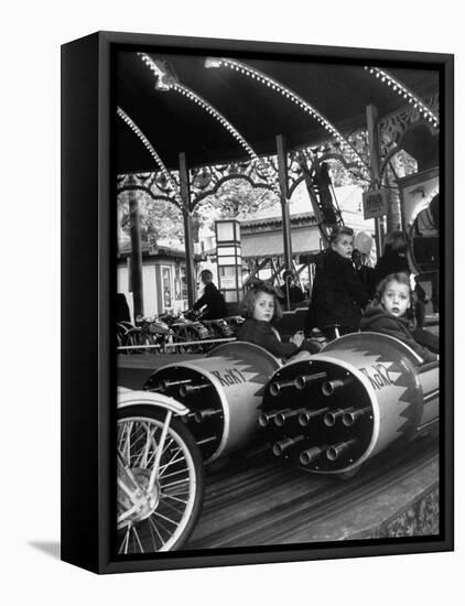 Children Waiting Expectantly For a "Rocket Ride" on the Carousel-Nina Leen-Framed Premier Image Canvas