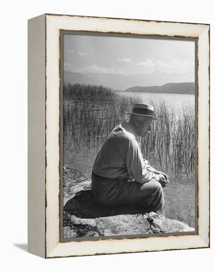 Swiss Psychiatrist Dr. Carl Jung Sitting on Stone Wall Overlooking Lake Zurich-Dmitri Kessel-Framed Premier Image Canvas