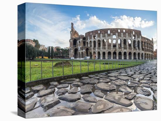 Blue sky at sunrise frames the ancient Colosseum (Flavian Amphitheatre), UNESCO World Heritage Site-Roberto Moiola-Premier Image Canvas