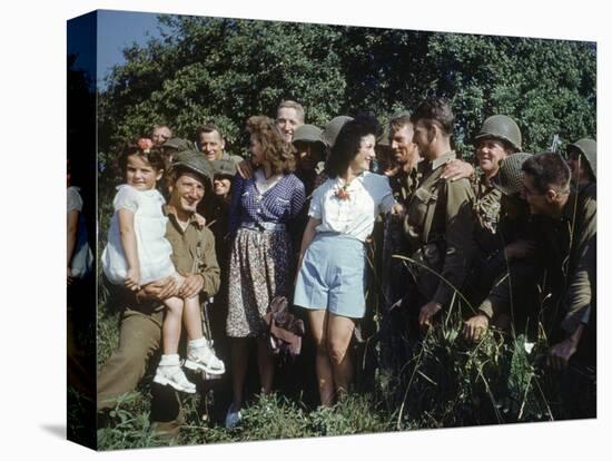 U.S. Soldiers Gather around a French Girl Near Avranches, France, August 1944-Frank Scherschel-Premier Image Canvas