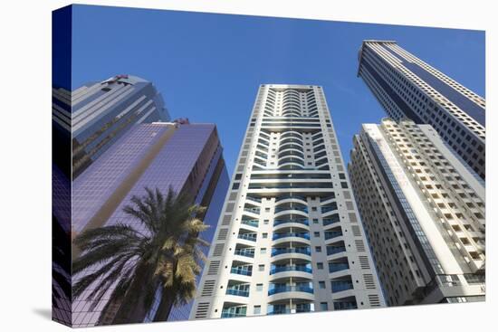 UAE, Downtown Dubai. High-rise buildings along Sheikh Zayed Road-Walter Bibikow-Premier Image Canvas