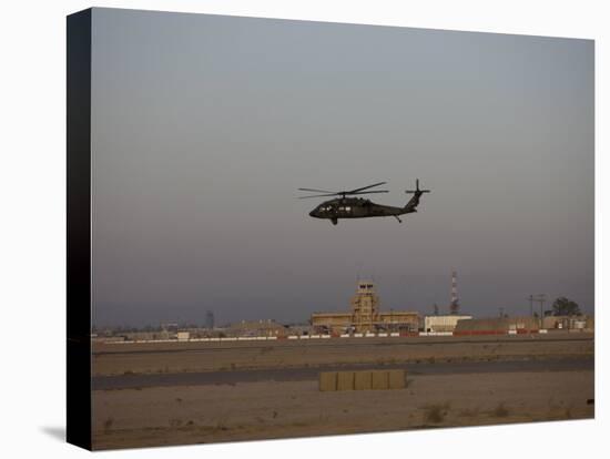 UH-60 Blackhawk Helicopter Flies Past the Tower on Camp Speicher-Stocktrek Images-Premier Image Canvas