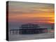 UK, England, Sussex, Brighton, Boat Sailing Past Remains of Brighton West Pier at Sunset-Jane Sweeney-Premier Image Canvas