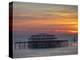 UK, England, Sussex, Brighton, Boat Sailing Past Remains of Brighton West Pier at Sunset-Jane Sweeney-Premier Image Canvas