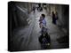 Ultra-Orthodox Jewish Children Cover their Faces as They Play in a Street in Jerusalem-null-Premier Image Canvas