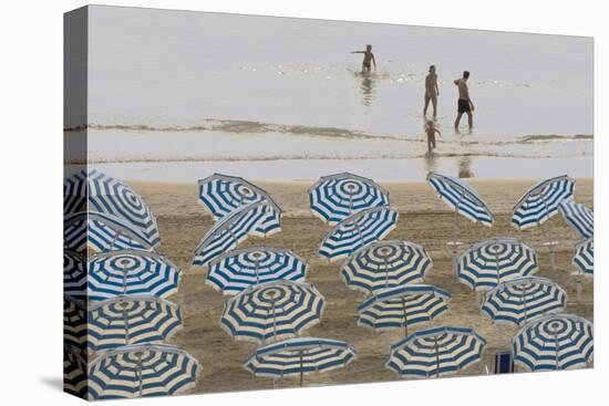 Umbrellas on the Beach, Family in the Sea, Jesolo, Venetian Lagoon, Veneto, Italy-James Emmerson-Premier Image Canvas