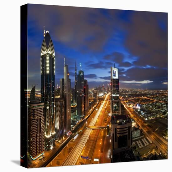 United Arab Emirates (UAE), Dubai, Sheikh Zayed Road Looking Towards the Burj Kalifa at Night-Gavin Hellier-Premier Image Canvas