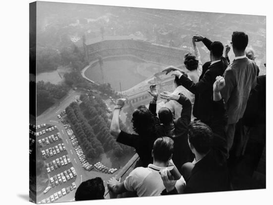 University of Pittsburgh Students Cheering Wildly from Atop Cathedral of Learning, School's Campus-George Silk-Premier Image Canvas