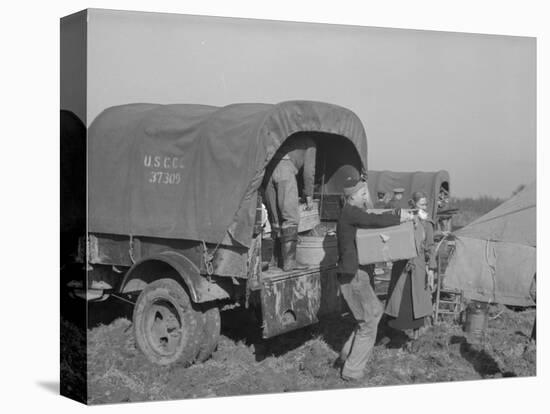 Unloading the goods of a family being moved into the camp for refugees at Forrest City, Arkansas-Walker Evans-Premier Image Canvas