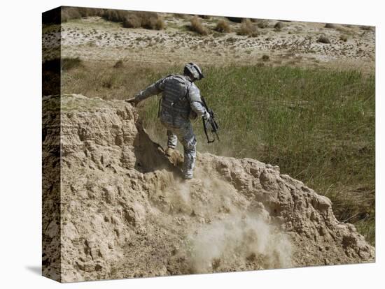 US Army Specialist Climbs Down to the Bottom of a Canal During a Foot Patrol in Iraq-Stocktrek Images-Premier Image Canvas