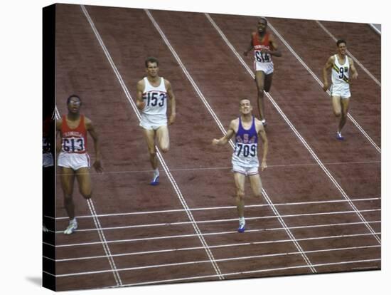 US Athlete Michael Larrabee Winning the 400 Meters at the Summer Olympics-George Silk-Premier Image Canvas