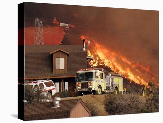 US Forest Service Air Tanker Drops Fire Retardant as the Fire Burns in the Hills Above a Home-null-Premier Image Canvas