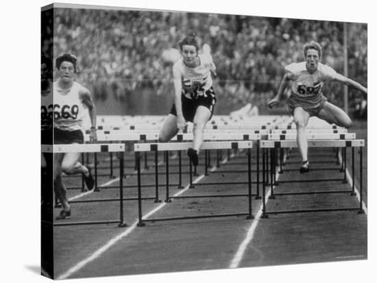 US Runner Fanny Blankers Koen Setting Olympic Record of 11.2 Seconds in 80 Meter Hurdles-Mark Kauffman-Premier Image Canvas