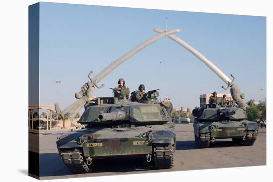 US Tanks Drive under the 'Hands of Victory' in Baghdad, Iraq, Ca. 2003-null-Stretched Canvas