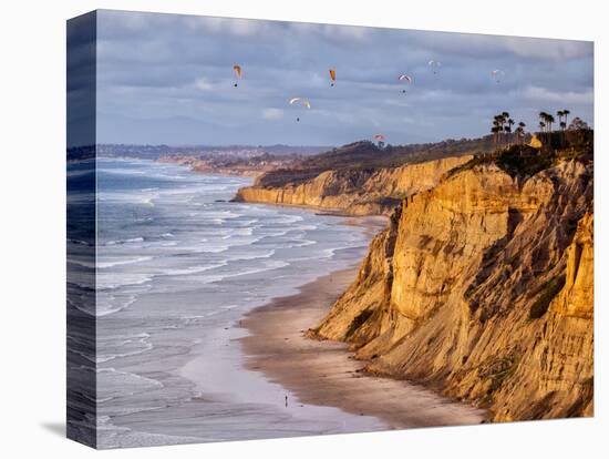 USA, California, La Jolla. Paragliders Float over Black's Beach in Late Afternoon-Ann Collins-Premier Image Canvas