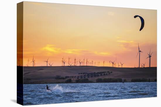 Usa, California, Rio Vista. Kiteboarder at sunset with wind farm turbines.-Merrill Images-Premier Image Canvas