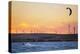 Usa, California, Rio Vista. Kiteboarder at sunset with wind farm turbines.-Merrill Images-Premier Image Canvas