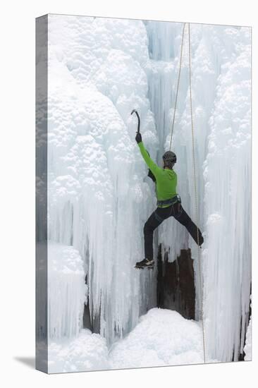 USA, Colorado, Uncompahgre National Forest. Climber ascends icy cliff face.-Jaynes Gallery-Premier Image Canvas