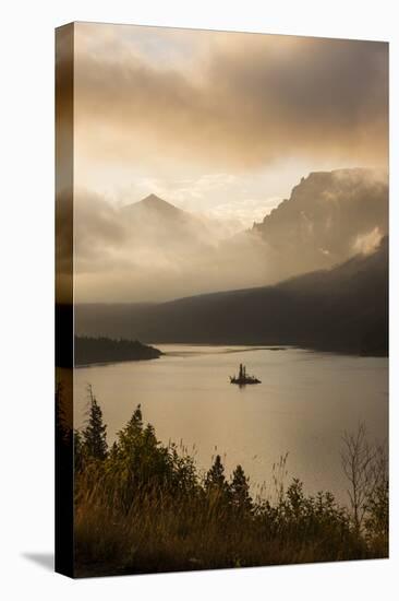 USA, Montana, Glacier NP. Sunrise pierces clouds over St. Mary Lake.-Don Grall-Premier Image Canvas