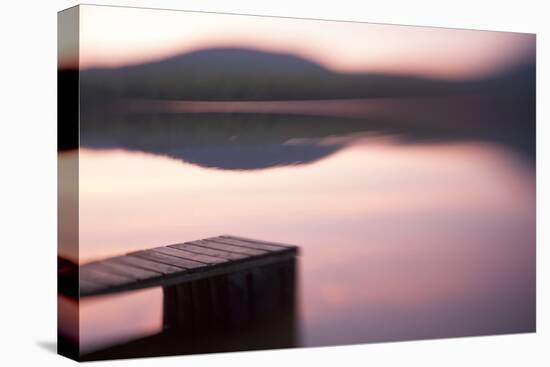 Usa, New Hampshire, Lyme. Dock and reflection of mountain in Hinman Pond at sunset.-Merrill Images-Premier Image Canvas