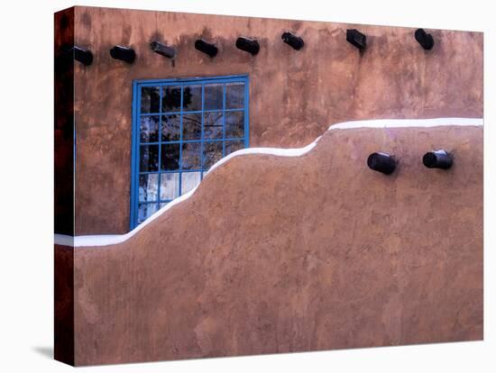 USA, New Mexico, Sant Fe, Adobe structure with protruding vigas and Snow-Terry Eggers-Premier Image Canvas