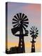 USA, Oklahoma, Elk City, Vintage Farm Windmills-Walter Bibikow-Premier Image Canvas
