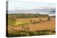 USA, Tennessee. Pastoral farm scene in morning light. Long shadows from hay bales-Trish Drury-Premier Image Canvas