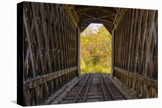 USA, Vermont, Fall foliage seen off Rt. 15, Wolcott, Fisher Covered Railroad Bridge (1908)-Alison Jones-Premier Image Canvas