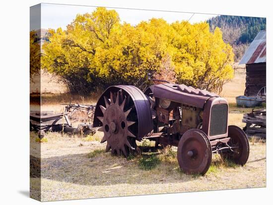 USA, Washington State, Molson, Okanogan County. Rusty old tractor in the historic ghost town.-Julie Eggers-Premier Image Canvas