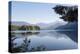 USA, Washington State. Morning calm Baker Lake under Mt. Shuksan. God Rays and two fishing boats-Trish Drury-Premier Image Canvas