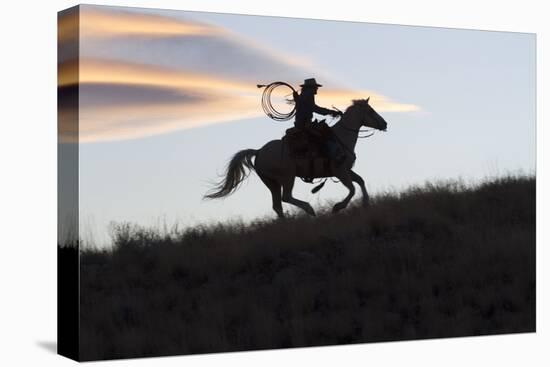 USA, Wyoming, Shell, The Hideout Ranch, Silhouette of Cowgirl with Horse at Sunset-Hollice Looney-Premier Image Canvas