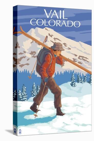 Vail, CO - Skier Carrying Skis-Lantern Press-Stretched Canvas