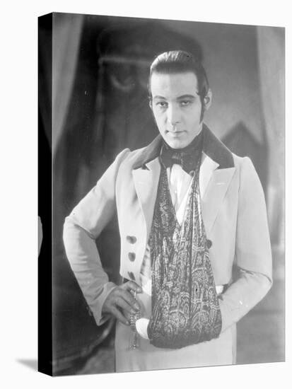 Valentino on the set of 'The Eagle' with his arm in a sling after a car accident, c.1925-null-Premier Image Canvas