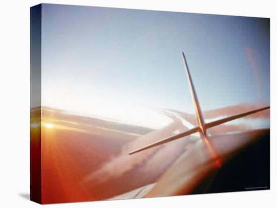 Vapor Trails Streaming from Tail of Jet in Flight-Howard Sochurek-Premier Image Canvas