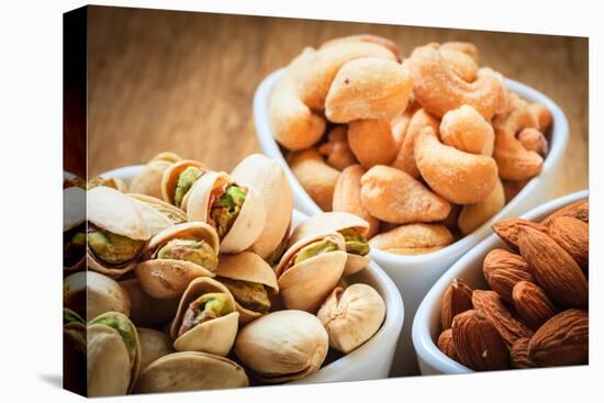 Varieties of Nuts: Cashew, Pistachio, Almond.-Voy-Premier Image Canvas