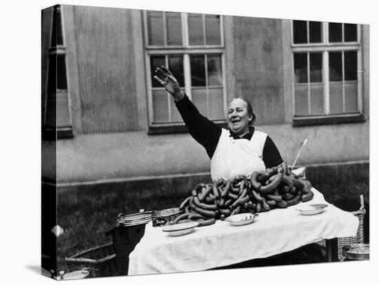Vendor Trying to Sell Bundles of Sausage-Margaret Bourke-White-Premier Image Canvas