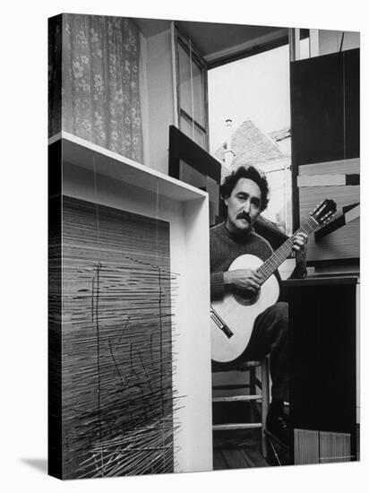 Venezuelan Kinetic Artist Raphael Jesus Soto, Playing Guitar in His Apartment-Pierre Boulat-Premier Image Canvas