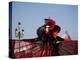 Venice, Veneto, Italy, a Mask in Costume on the Bacino Di San Marco with the Cupola of Santa Maria -Ken Scicluna-Premier Image Canvas