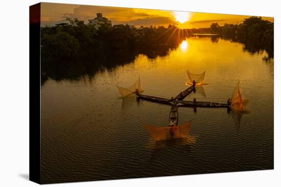 Vietnam. Coordinated lagoon fishing with nets at sunset.-Tom Norring-Premier Image Canvas