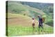 Vietnam. Grandma taking care of granddaughter. Farming community with traditional Sapa dresses.-Tom Norring-Premier Image Canvas